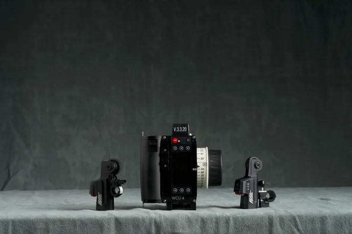 ARRI WCU-4 hand unit with two focus motors laid out on the studio cloth.