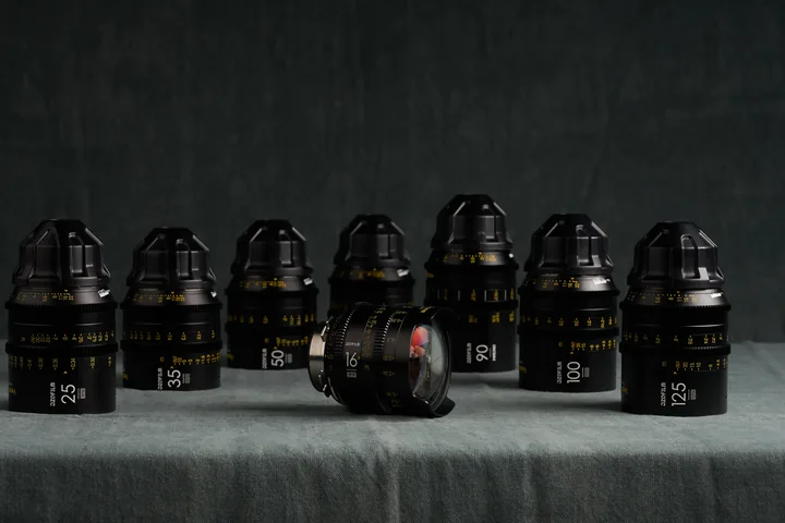 Row of DZO Vespid prime lenses against the studio backdrop.