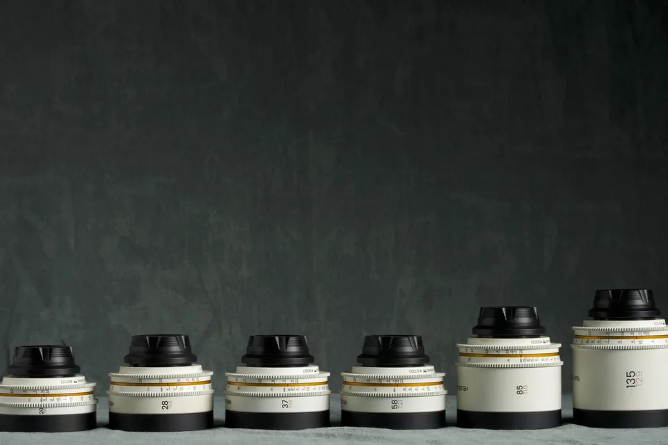 Six rehoused Iron Glass vintage primes in pale housings on the studio cloth.