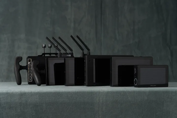 A row of cinema grade on-camera monitors against the studio backdrop.