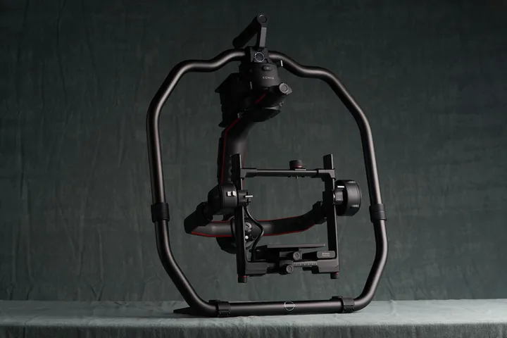 DJI Ronin 2 gimbal built up in its cage against the studio backdrop.
