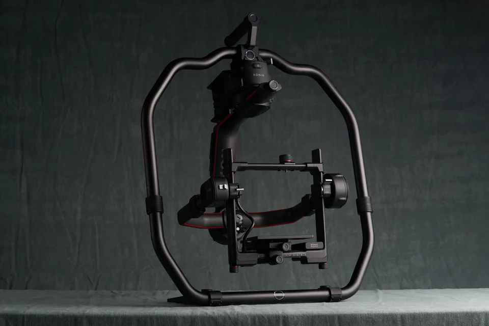 DJI Ronin 2 gimbal built up in its cage against the studio backdrop.