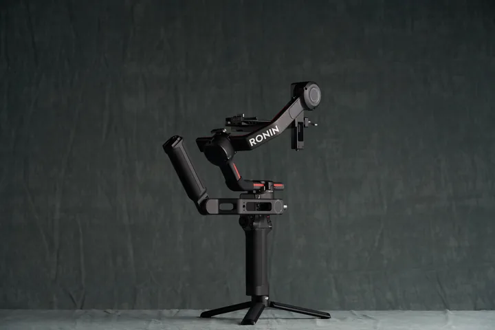 DJI Ronin RS3 Pro gimbal on a stand against the studio backdrop.