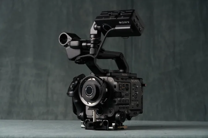 Sony FX6 rigged with cage and handle on the studio table.