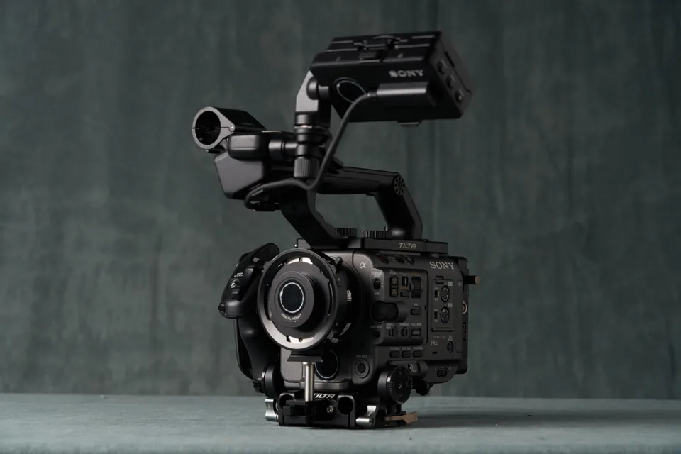 Sony FX6 rigged with cage and handle on the studio table.