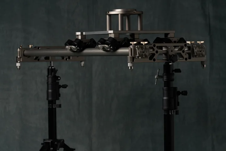 Tilta cinema slider set up on two stands against the studio backdrop.